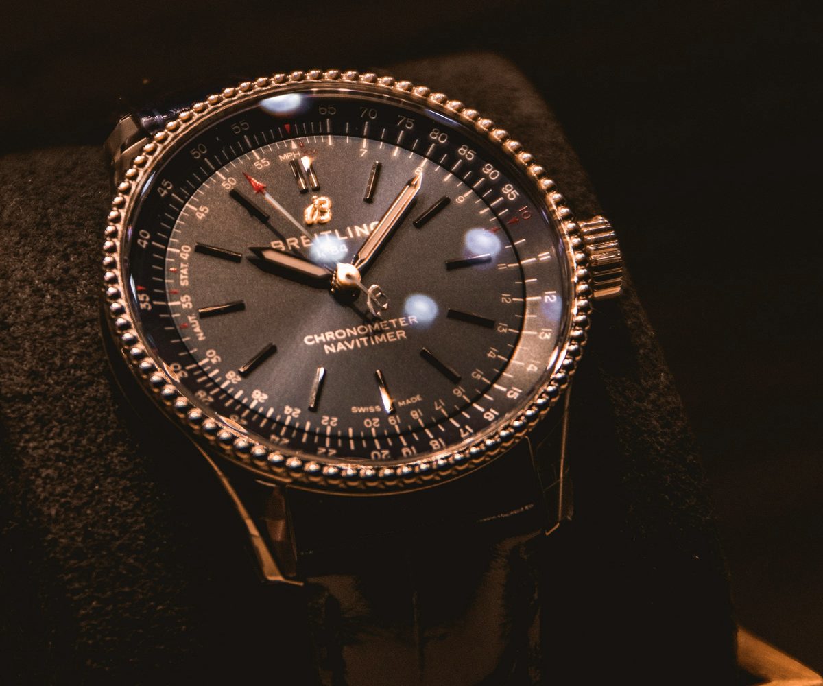 Rose gold watch on stone, flash USDT wallet